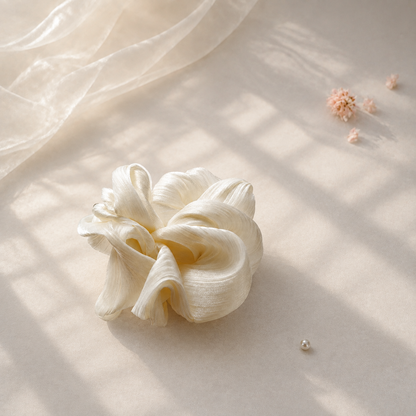 Ivory pleated shimmer scrunchie glowing in natural sunlight by Luna Dot