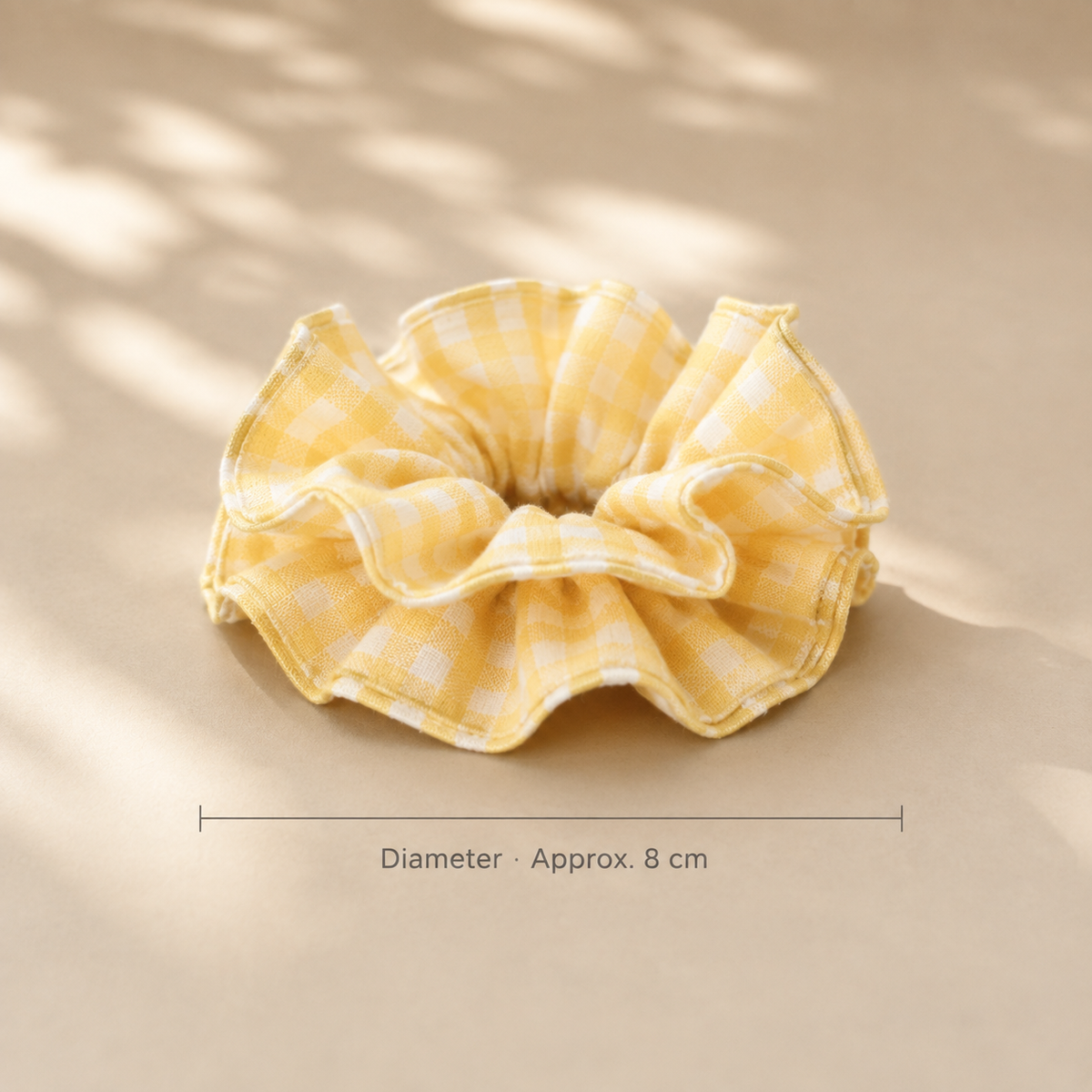 Close-up of butter-yellow and white gingham cotton fabric